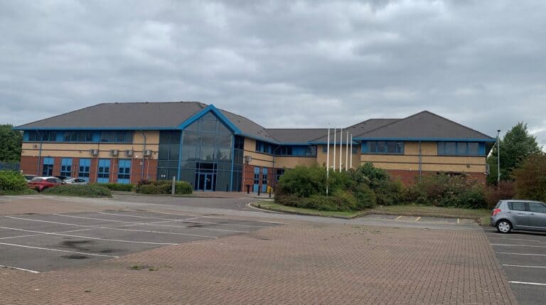 Reresby House, Rotherham — a vacant modern office building with an empty car park
