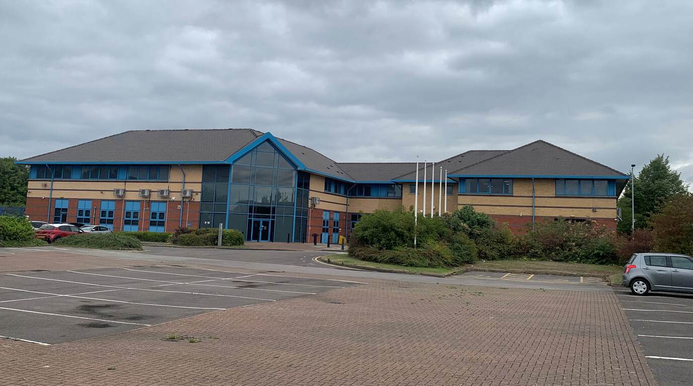 Reresby House, Rotherham — a vacant modern office building with an empty car park
