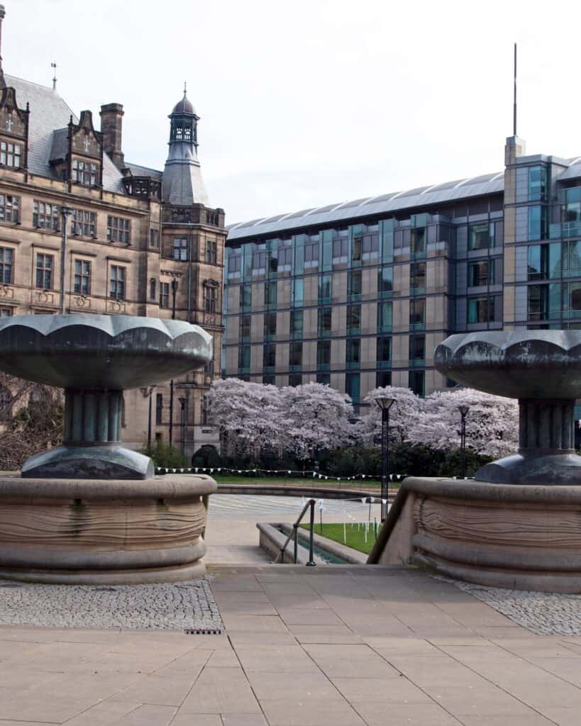 Sheffield Town Hall and the Peace Gardens fountains in spring blossom