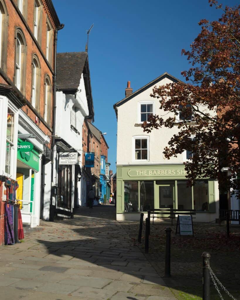 Victoria Square in Ashbourne, Derbyshire, with shopfronts and timber-framed buildings