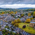 Aerial view of Bakewell with the spire of All Saints Church above the stone rooftops