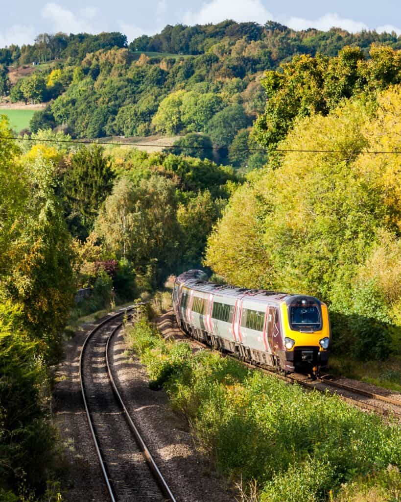 The wooded Derwent valley at Duffield in autumn, with the railway line curving through it
