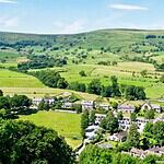The village of Castleton in the Hope Valley with Mam Tor rising behind
