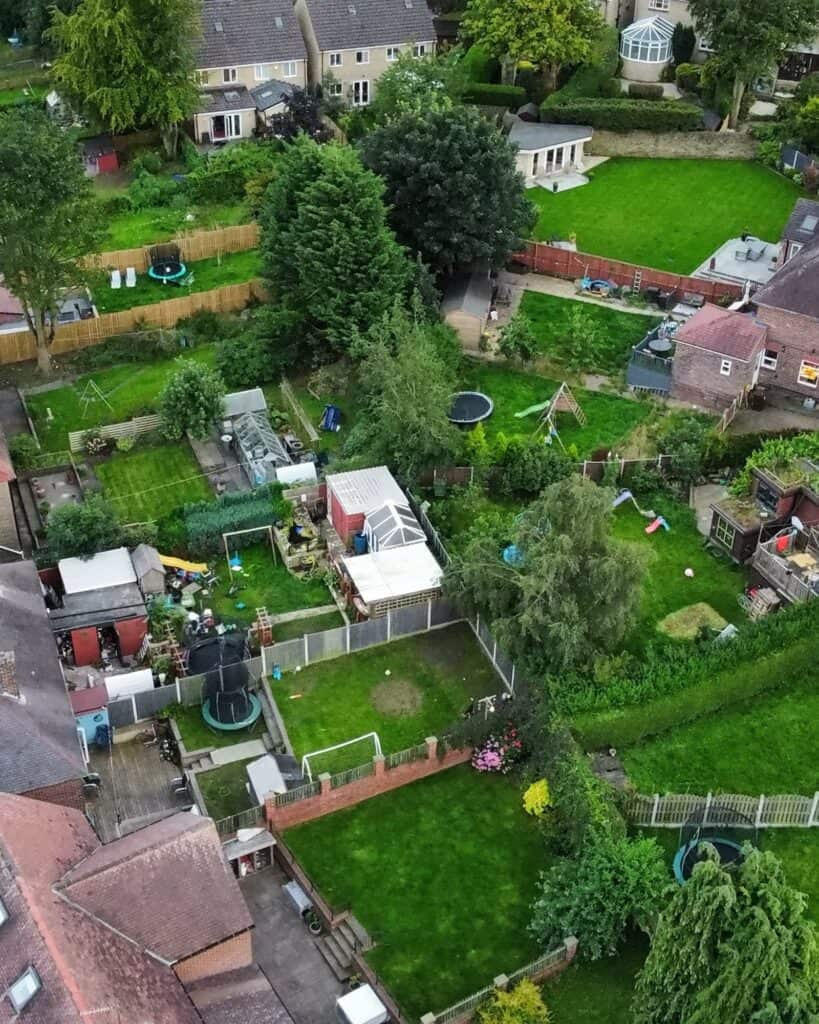Aerial view of a suburban Sheffield street of houses with long back gardens